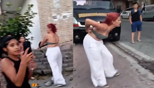 Gözaltına alınan genç kız soyundu!